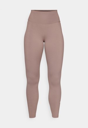 High-waisted leggings in a muted mauve color, made of smooth stretchy fabric, featuring minimal stitching and a small logo at the hem.