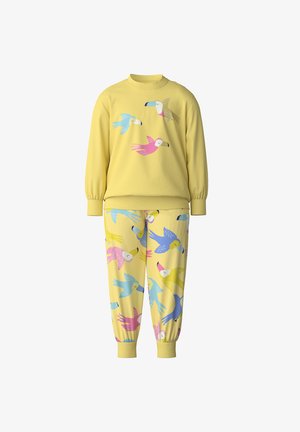 Yellow sweatshirt with colorful bird print, paired with matching yellow pants featuring a similar bird pattern. Made from soft, cozy fabric.