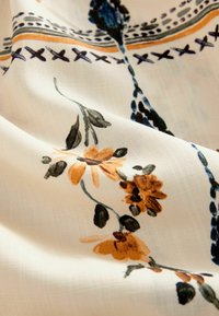 Next Tygbyxor - neutral sunflower print