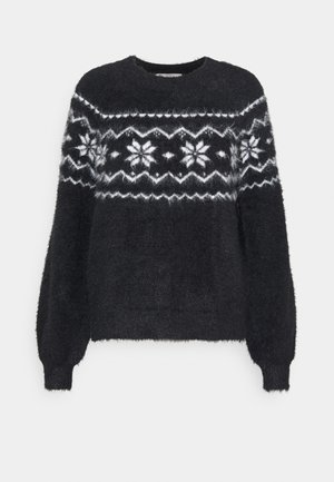 Pull noir duveteux avec motifs blancs de flocons de neige et zigzags sur la poitrine et les manches, col rond et manches longues avec poignets côtelés.