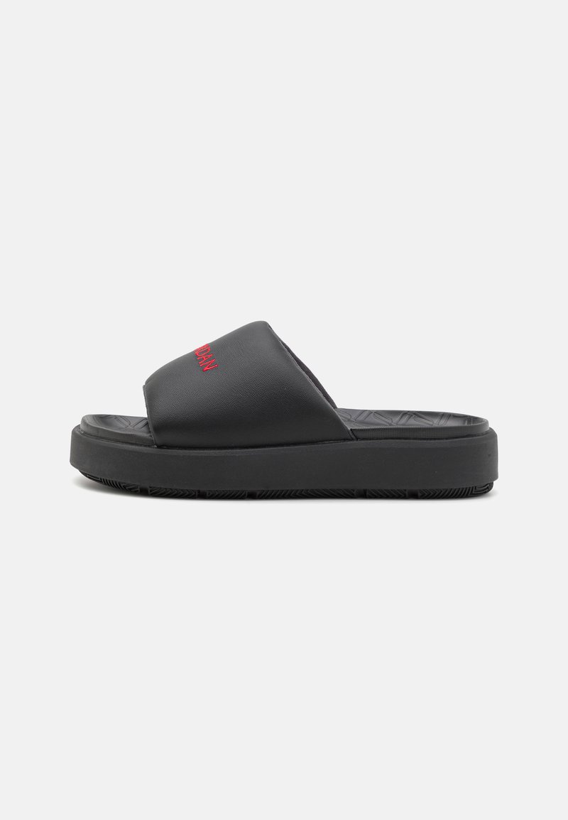 Black slides with a textured rubber sole, featuring a smooth upper and red embroidery. The design is open-toed with a low profile.