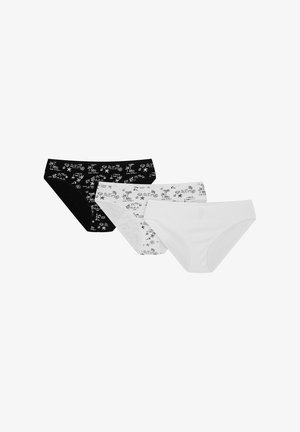 Black, white, and patterned cotton briefs. Black pair features white graphic designs, white pair has subtle texture with simple patterns.