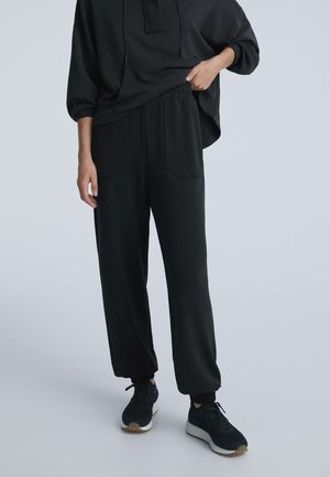 SOFT-TOUCH JOGGERS - Tracksuit bottoms - black