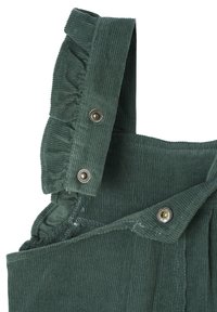 Green corduroy overalls feature ruffled straps and silver snap buttons, with a textured fabric and pleated accents for added detail.
