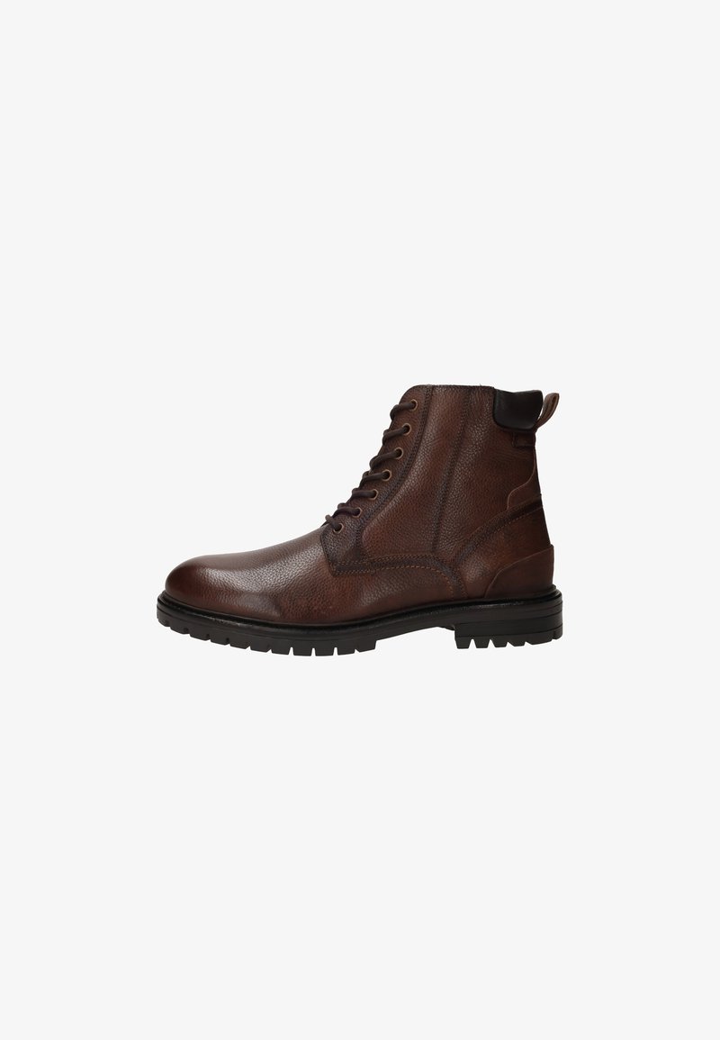 Bottine en cuir marron avec finition texturée, bout rond, six œillets et une languette au talon. Semelle en caoutchouc durable avec motif antidérapant.