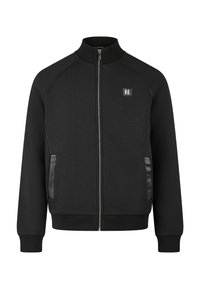 Giacca nera con cerniera, realizzata in tessuto liscio, con collo alto, tasche laterali con dettagli in pelle e un piccolo logo sulla parte anteriore.