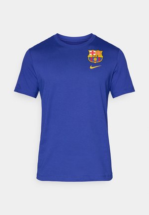 Blue short-sleeve t-shirt made of soft fabric featuring a Barcelona logo and a yellow Nike swoosh on the chest area.