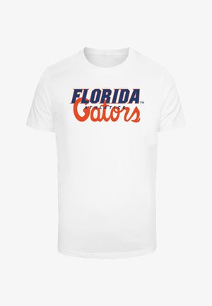 Fehér pamut póló, amelyen kék színnel "FLORIDA ATHLETICS" és narancsszínnel "Gators" felirat található. Rövid ujjak, környak, normál szabás, minta nélkül.