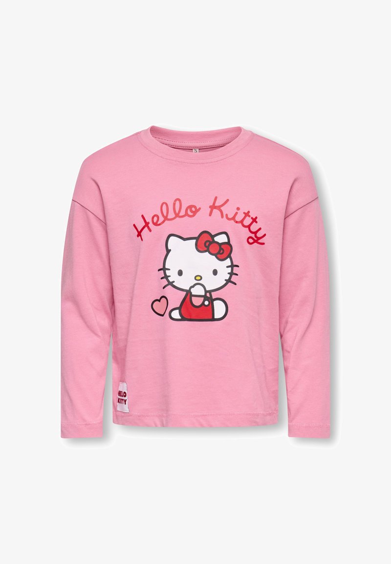 Roosa pikkade varrukatega T-särk, millel on punase ja valge Hello Kitty graafika, punane lips ja südamekujuline kujundus trükitud esiküljele.