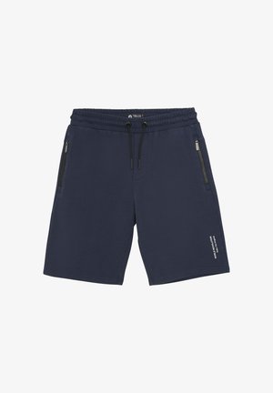 Shorts bleu marine en tissu doux. Ils disposent d'une taille élastique avec cordon de serrage, de deux poches latérales zippées et d'un détail textuel imprimé sur la jambe.