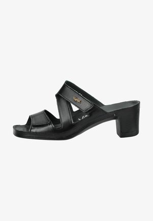 Mule donna in pelle nera con punta aperta, tacco basso a blocco e due cinturini regolabili sul piede e alla caviglia.