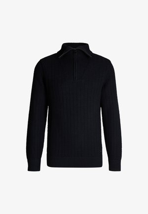 Strickpullover in Schwarz mit hohem Kragen und Halb-Reißverschluss-Design. Verfügt über eine gerippte Textur und enganliegende Bündchen, die eine strukturierte Silhouette bieten.