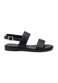 Sandali in pelle nera con due ampie cinghie e una cinghia alla caviglia posteriore con una fibbia argentata. Sole piatto con design minimalista.