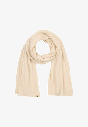 Beige gestrickter Schal mit einer weichen Textur, der ein dezentes Muster aufweist, in einer Schleife drapiert ist und mit einem kleinen Markenetikett versehen ist.