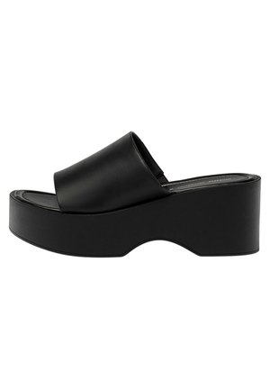 Black platform slide sandal with a wide smooth strap, rounded toe, and a chunky, curved sole. Made of synthetic material, featuring a matte finish.