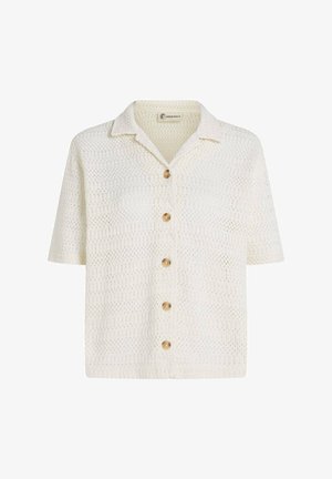 Valge lühikeste varrukatega topp kraega kaelusega, millel on tekstuurse heegeldatud mustriga ning esiküljel viis ümmargust puidust nööpi.