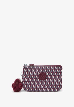 Small zippered pouch with maroon, gray, and white geometric pattern, circular Kipling logo, and maroon furry monkey keychain attached.