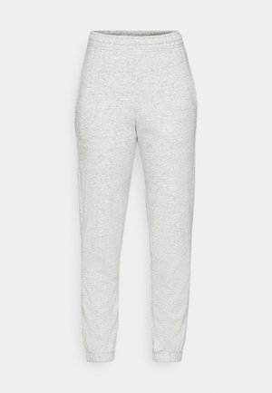Pantalons de survêtement gris clair en tissu doux et texturé. Dotés d'une taille élastique et de chevilles effilées. Design simple sans poches ni motifs.