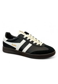 Black and white sneaker with suede and leather materials, featuring three white stripes, cream laces, and "Gola" logo in gold.