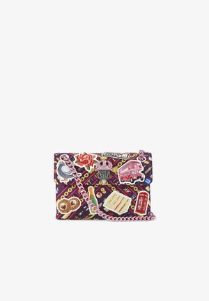 Colorful crossbody bag with purple fabric, adorned with various patches, including food items and landmarks, and a pink chain strap.
