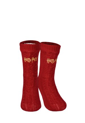 Pair of red knitted socks with cable patterns, featuring yellow "Harry Potter" text embroidered near the top cuff.