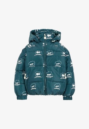 Veste matelassée bleu canard avec capuche, présentant un motif de visages de monstres blancs. Le matériau est brillant et matelassé avec des poignets élastiques.