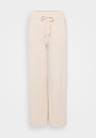 Beige wide-leg pants with a soft texture, featuring a drawstring waistband and side pockets. Straight cut with clean hems.