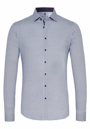 Langarmshirt in lichtblauw met een rond marineblauw patroon, knoopsluiting aan de voorkant en contrasterende kraag. Katoenen materiaal met een gladde textuur.