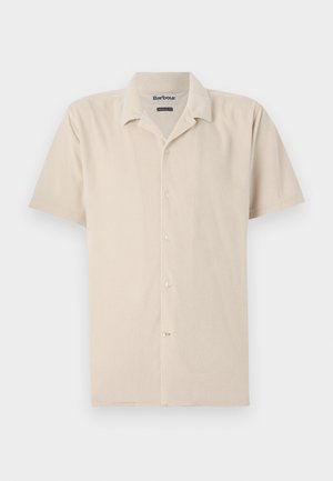 Lühikeste varrukatega beež särk, mis on valmistatud pehmest kangast ja millel on nööpidega esiosa, klassikaline krae ja peene struktuur.