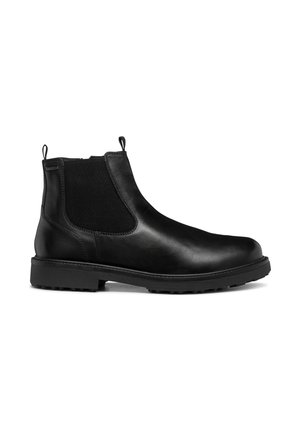 Botas de tobillo de cuero negro con paneles laterales elásticos, punta redondeada y tiradores; suela texturizada para tracción. Diseño minimalista.
