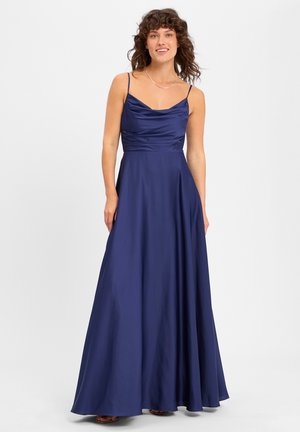 Navy blue satin gown with spaghetti straps, cowl neckline, fitted bodice, and a flowing A-line skirt. Smooth texture with minimal detailing.