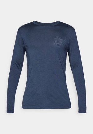 Pikkade varrukatega tumesinine särk pehmest ja siledast kangast. Vasakul rinnakutel on tagasihoidlik lilleline muster ning ümmargune kaelus.