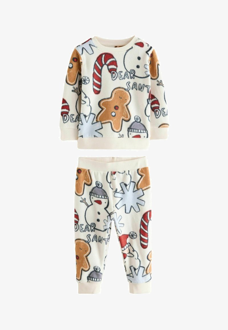 Fleece-Pyjama-Set mit einem cremefarbenen Hintergrund, der mit Lebkuchenmännern, Zuckerstangen, Schneemännern und Schneeflocken in verschiedenen festlichen Farben gestaltet ist.