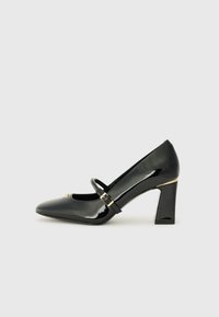 Black patent leather high heel shoe with a pointed toe, ankle strap, and gold accent at the heel. Square block heel design.