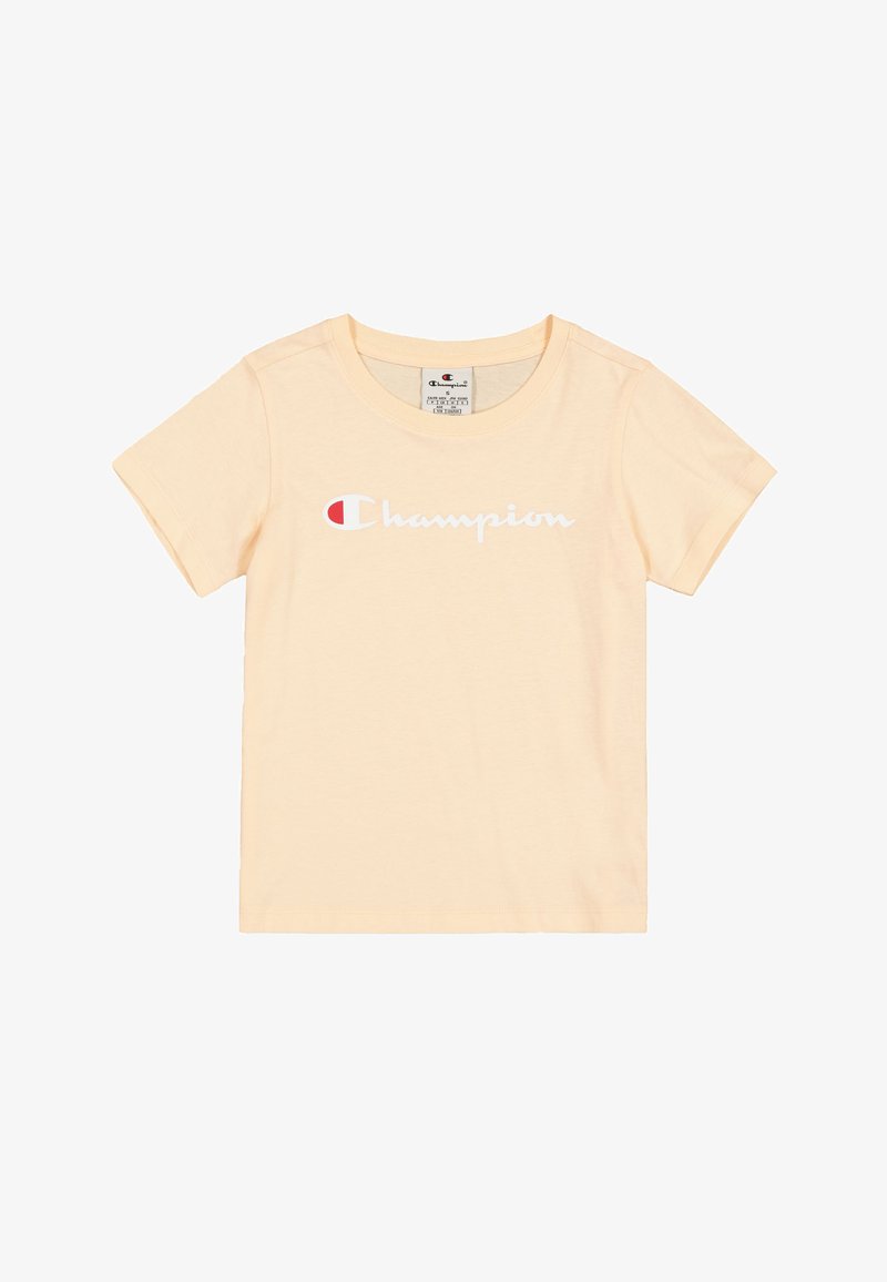 Camiseta de algodón amarillo claro con mangas cortas, que presenta un logo blanco de "Champion" y un acento rojo en el lado izquierdo.