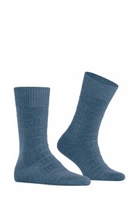 Calze blu in maglia con lavorazione a coste e motivi a righe diagonali, caratterizzate da un design di lunghezza crew e un aspetto morbido e tessuto.