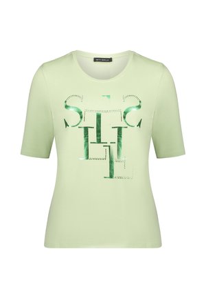 T-shirt vert clair à manches courtes en tissu doux, avec un imprimé graphique vert brillant contrastant sur le devant. Col rond, coupe ajustée.