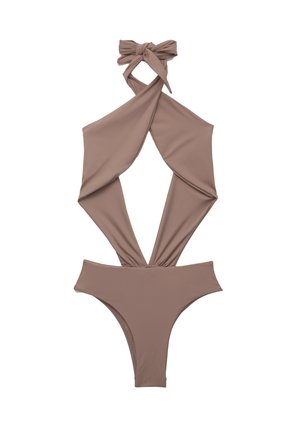 Costume intero marrone con scollo a halter e lacci. Presenta ampi ritagli, tessuto morbido e copertura minima per un design contemporaneo.