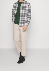 Tommy Hilfiger Triko s potiskem - dark green