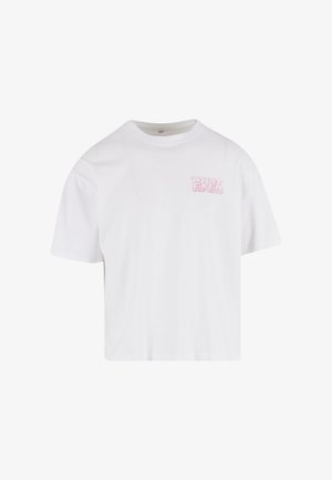 White cotton t-shirt with short sleeves, a crew neck, and a pink graphic text printed on the left side that reads "WHAT EVER YOU WANT."