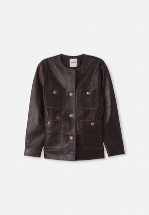 Brown leather jacket with a rounded neckline, four patch pockets, gold button accents, and contrasting seams. Smooth texture and straight cut.