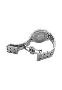 Reloj de acero inoxidable con caja redonda, pulsera de metal plateado, acabado cepillado y pulido, y cierre de broche. Cuenta con una parte trasera resistente al agua.