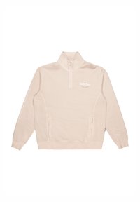 Light beige quarter-zip sweatshirt with high collar, side pockets, and white logo on chest and sleeve. Soft, smooth fabric texture.
