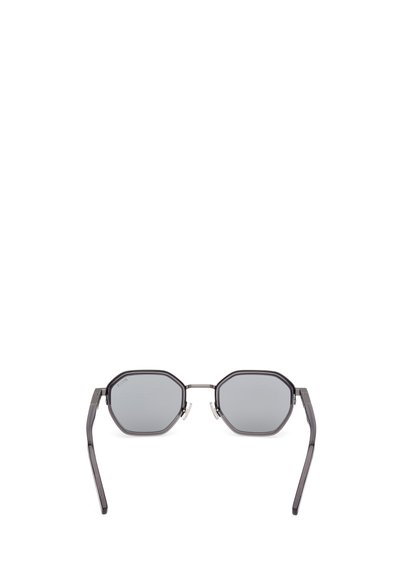 Ochelari de soare octogonali cu un cadru metalic întunecat și lentile gri. Brațele subțiri se subțiază la capete, având un design minimalist și fără modele vizibile.