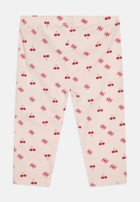 Leggings roz cu imprimeu cu cireșe pe toată suprafața și model cu logo, având o talie elastică și un material neted, elastic.