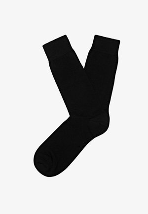 Czarne skarpetki do kostki o gładkiej fakturze, z wzmocnioną piętą i palcami oraz prążkowanymi mankietami. Prosty design, bez widocznych wzorów czy akcentów.