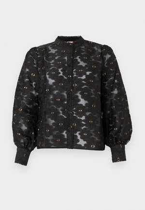 Czarna przezroczysta bluzka z kwiatowym wzorem z koronki, złotymi akcentami, długimi bufiastymi rękawami, zapięciem na guziki z przodu oraz wysokim kołnierzem z dekoracyjnym wykończeniem.