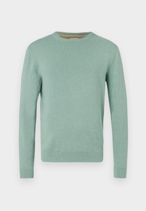 Miętowy sweter wykonany z miękkiej dzianiny. Posiada okrągły dekolt, długie rękawy oraz ryflowane mankiety i dół. Minimalistyczny design.