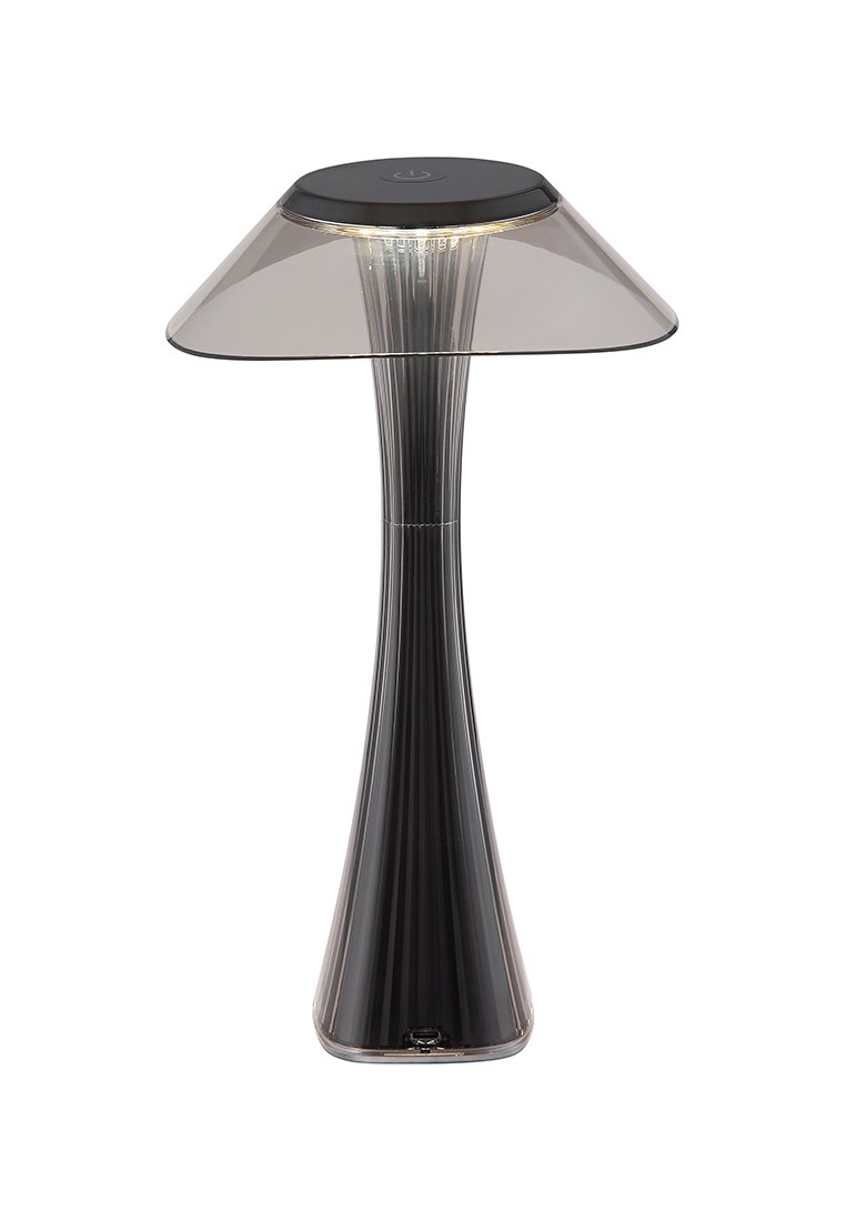 Průhledná akrylová stolní lampa s rozšířeným stínidlem, prodlouženou základnou a žebrovaným povrchem. Obsahuje černý vršek s osvětleným panelem pod ním.