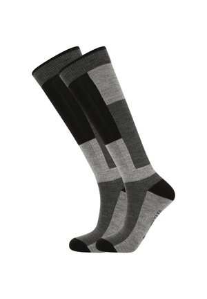 Knielange Socken mit einem geometrischen Muster in verschiedenen Schwarz- und Grautönen, aus einem weichen, strukturierten Stoff mit einfarbigen schwarzen Akzenten.